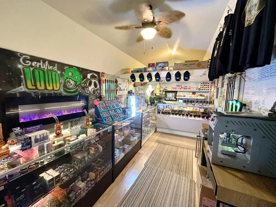 Inside Craft Country Exotics — display cases, Certified Loud mural, and shop floor